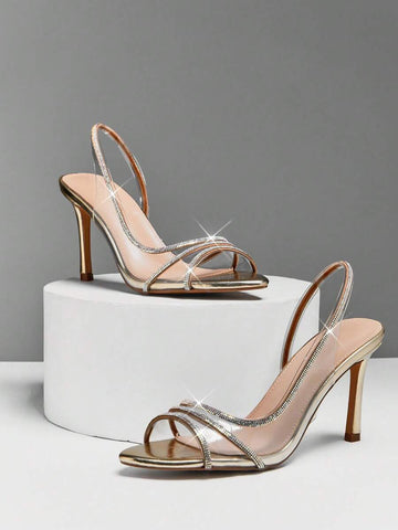 Step into sophistication with these stunning silver stiletto heels, designed to elevate any special occasion. The sleek metallic finish pairs beautifully with delicate clear rhinestone straps that catch the light with every movement, adding a touch of glamour and sparkle. Perfect for weddings, galas, cocktail parties, and formal events, these heels deliver timeless elegance with modern flair. 