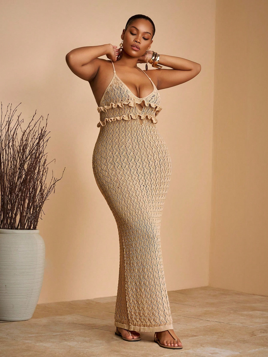 Step into summer with this playful yet elegant sleeveless apricot knit maxi dress. Its breezy fabric and flattering silhouette make it your go-to for sun-soaked vacations, romantic evenings, or those special moments that call for a touch of charm. Effortlessly stylish and comfortable, this dress brings warmth and whimsy to every occasion.