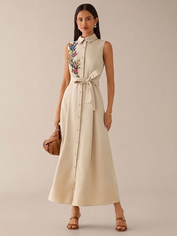 Step out in style with this elegant sleeveless embroidered shirt dress, perfect for both urban adventures and romantic evenings. Its delicate embroidery adds a touch of charm, while the sleeveless design keeps you cool and comfortable all day. Whether you're strolling through the city or enjoying a date night, this dress effortlessly blends sophistication with playful ease.