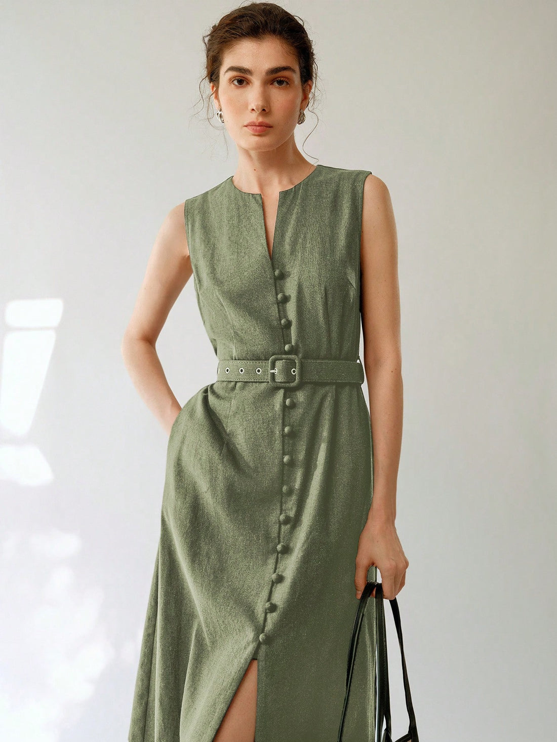 Elevate your wardrobe with this breezy sleeveless linen midi dress that's ready for whatever your day throws at you! The included belt cinches your waist just right, creating that effortlessly chic silhouette we all crave. Perfect for brunching with the girls or turning heads at summer gatherings—this dress does the styling work for you while you're busy being fabulous!
