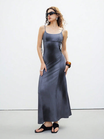 Step out in style with this playful and elegant sleeveless midi dress. Featuring delicate spaghetti straps and a charming tie-back detail, it offers a flirty yet sophisticated look perfect for any occasion. The flattering midi length adds a touch of grace, making it your go-to dress for sunny days or evening fun. Embrace effortless elegance with a twist of whimsy!