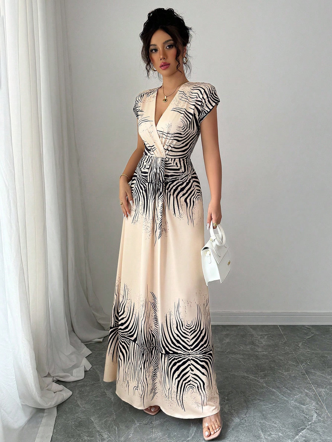 Unleash your wild side in this Elegant Sleeveless Tiger Striped Summer Dress for Women. Perfect for the spring and summer, this fashionable outfit will have you looking fierce yet elegant. Embrace the playful and quirky design while staying cool and stylish in the warm weather. (Tame pun intended.)