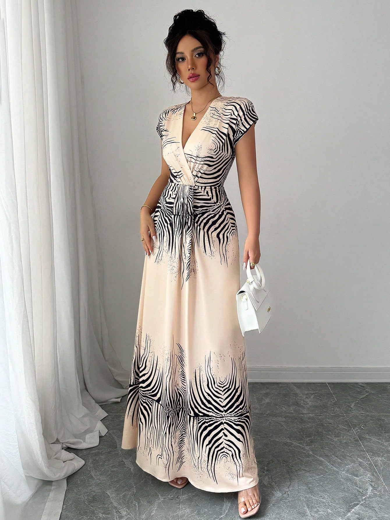 Unleash your wild side in this Elegant Sleeveless Tiger Striped Summer Dress for Women. Perfect for the spring and summer, this fashionable outfit will have you looking fierce yet elegant. Embrace the playful and quirky design while staying cool and stylish in the warm weather. (Tame pun intended.)