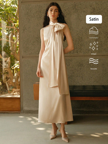 Be the belle of the wedding in our Elegant Sleeveless Wedding Guest Dress. With a stylish shawl collar and flowing maxi length, this dress is perfect for any formal occasion. Say "I do" to comfort and style with this must-have piece for women.