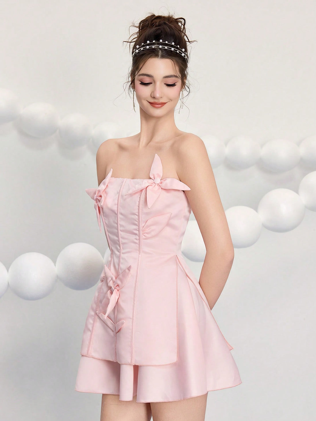 Turn heads at your next celebration in this stunning bandeau mini dress! Featuring eye-catching 3D floral details that pop against a sleek solid color base, this dress is your go-to for parties, birthdays, and weddings. The strapless bandeau design offers a chic, modern silhouette that's both flattering and fun. Perfect for making a memorable entrance, this piece combines elegance with playful flair—because who says you can't be sophisticated and fabulous at the same time?
