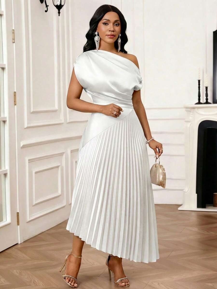 Elevate your everyday style with this sophisticated asymmetric shoulder dress. Crafted in a timeless solid color, this mid-length silhouette flatters with its modern one-shoulder design and flowing fabric. Perfect for transitioning from office to evening, it pairs effortlessly with heels or flats. The elegant cut creates a polished look that works for brunches, dinners, or special occasions. A versatile wardrobe essential that combines comfort with contemporary elegance.
