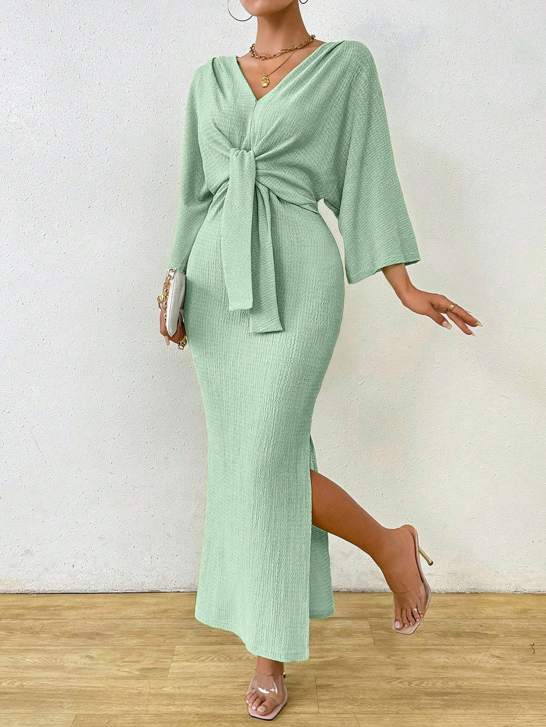 Look chic and feel comfortable in our Elegant Solid Color Bodycon Dress. Featuring a flattering waist knot and stylish batwing sleeves, this dress is perfect for any occasion. Say goodbye to boring outfits and hello to a playful and trendy look!