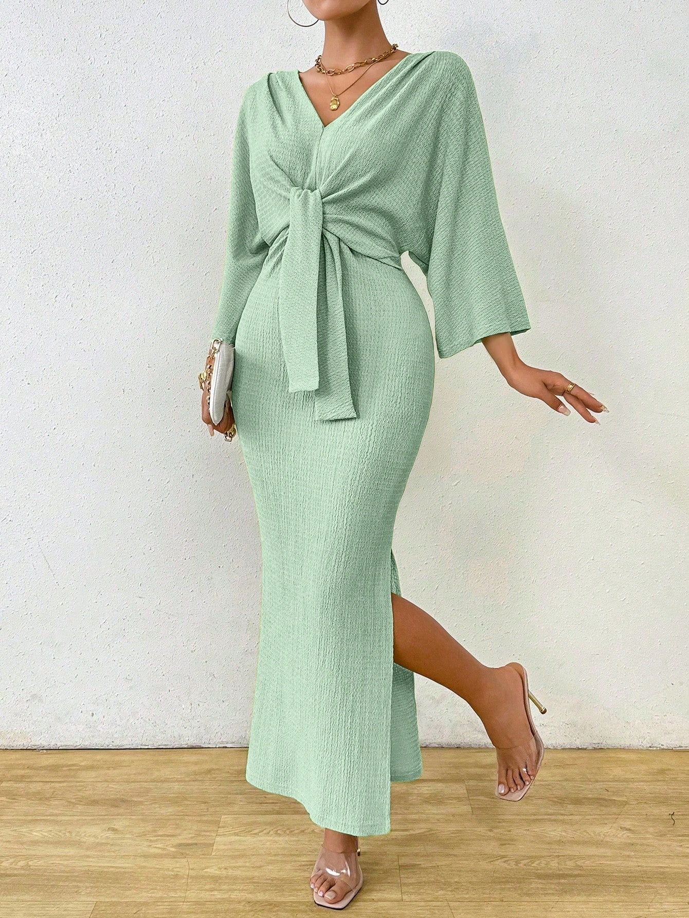 Look chic and feel comfortable in our Elegant Solid Color Bodycon Dress. Featuring a flattering waist knot and stylish batwing sleeves, this dress is perfect for any occasion. Say goodbye to boring outfits and hello to a playful and trendy look!
