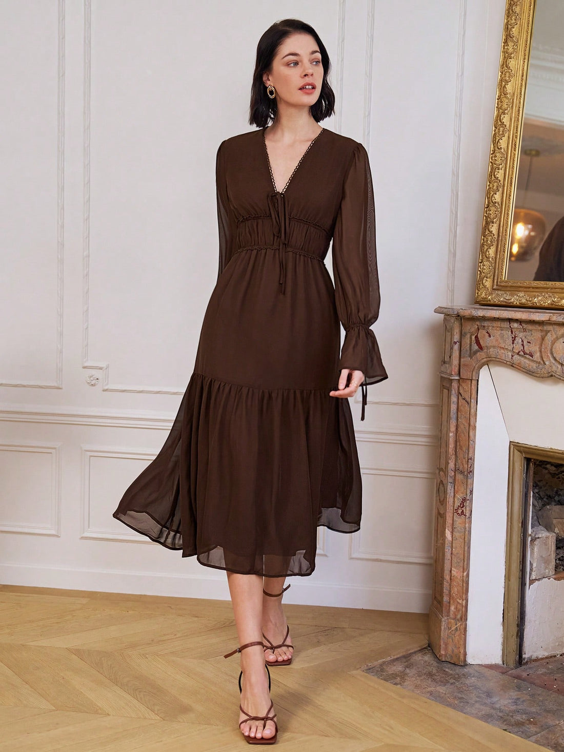 Effortlessly chic and undeniably flirty, this chiffon dress is your new spring and summer essential. The long sleeves offer a touch of elegance while the tie-up waist and ruched detailing create a flattering silhouette that moves with you. Crafted in a timeless solid color, it's the perfect piece for brunch dates, garden parties, or whenever you want to feel polished without trying too hard. Lightweight and breathable, this dress transitions seamlessly from day to night.