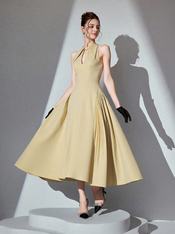 Step into the spotlight in this stunning halter neck ball gown that's pure magic! Crafted in a luxurious solid color, this showstopper features a flattering halter design that frames your shoulders beautifully while the voluminous skirt creates an enchanting silhouette. Whether you're dancing the night away at a gala, walking down the aisle, or making a grand entrance at your next formal event, this gown delivers elegance with a touch of whimsy. The timeless design ensures you'll feel like royalty, while th