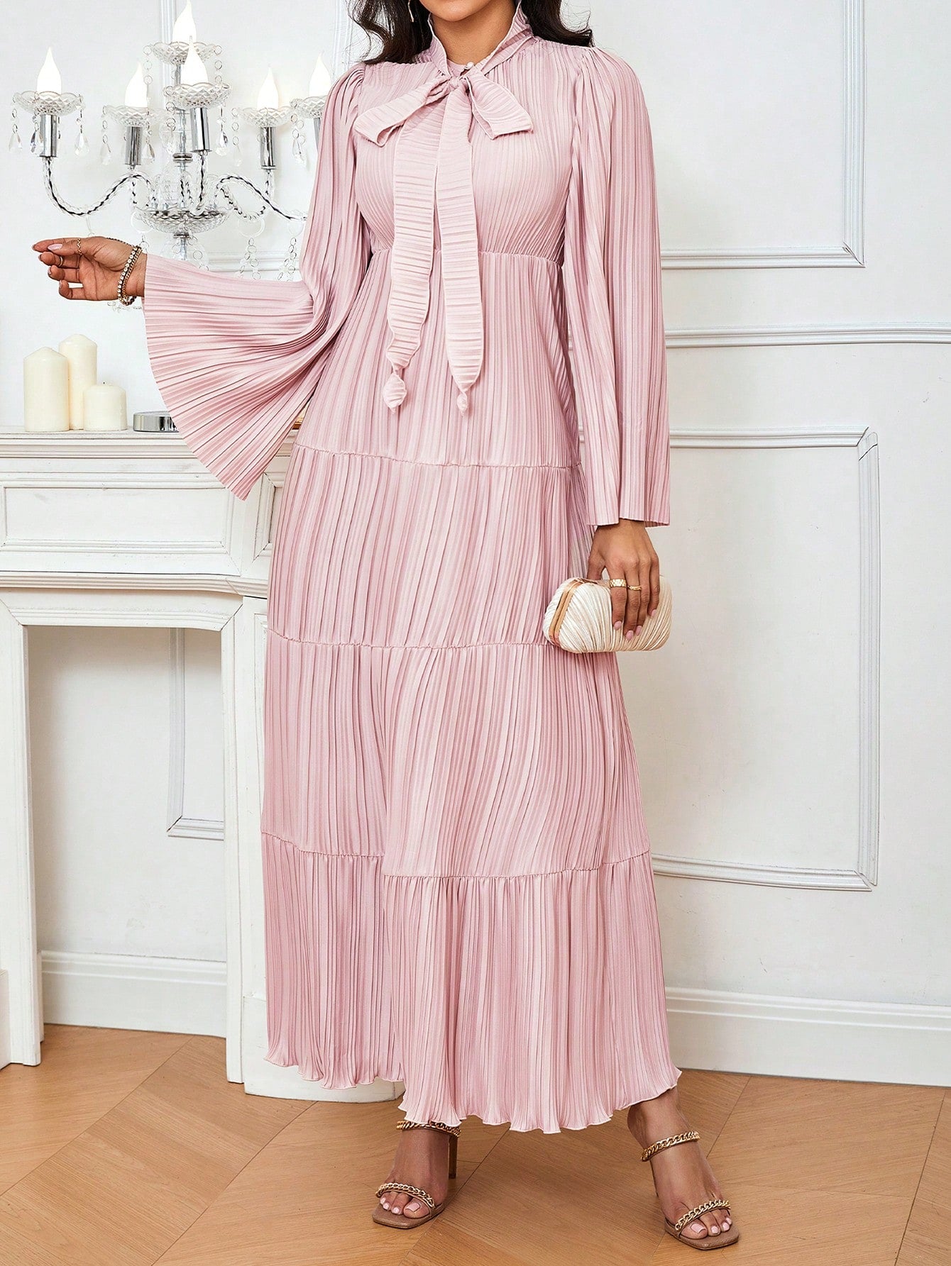 Step into the wedding party with effortless grace in this stunning bridesmaid dress. Featuring a chic knot collar detail and flattering pleated silhouette, this solid-color gown brings timeless elegance to any celebration. The refined design works beautifully for bridesmaids who want to look polished without overshadowing the bride. Perfect for creating a cohesive bridal party look that photographs beautifully and feels comfortable all day long.