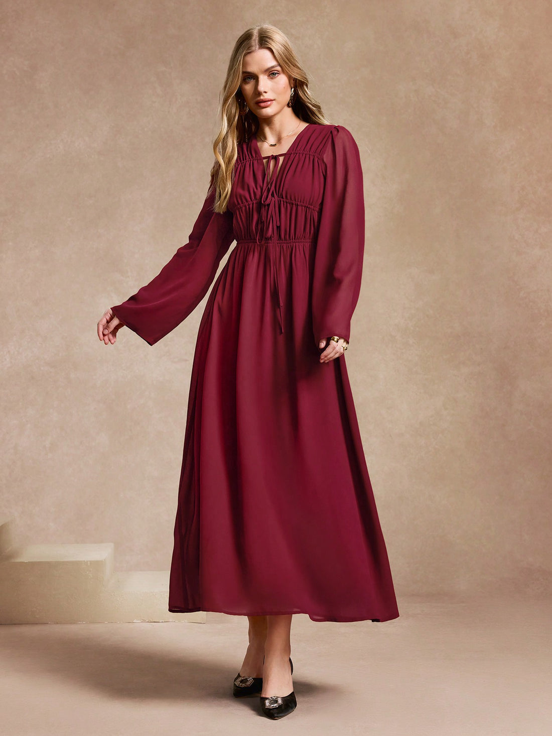 Ring in the New Year in style with our Elegant Solid Color Pleated Bubble Sleeve Midi Dress! This stunning dress features a playful tie front and chic bubble sleeves, perfect for any New Year's celebration. Elevate your look with this versatile and eye-catching dress.