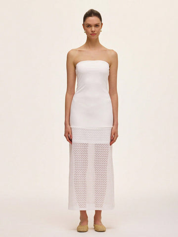 Step out in style with this elegant strapless dress featuring a solid color design and a delicate lace hollow hem. Perfect for turning heads at any event, its playful yet sophisticated look lets you dance the night away with confidence and charm.