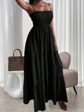 Black smocked tiered maxi sundress with thin straps and ruffle neckline