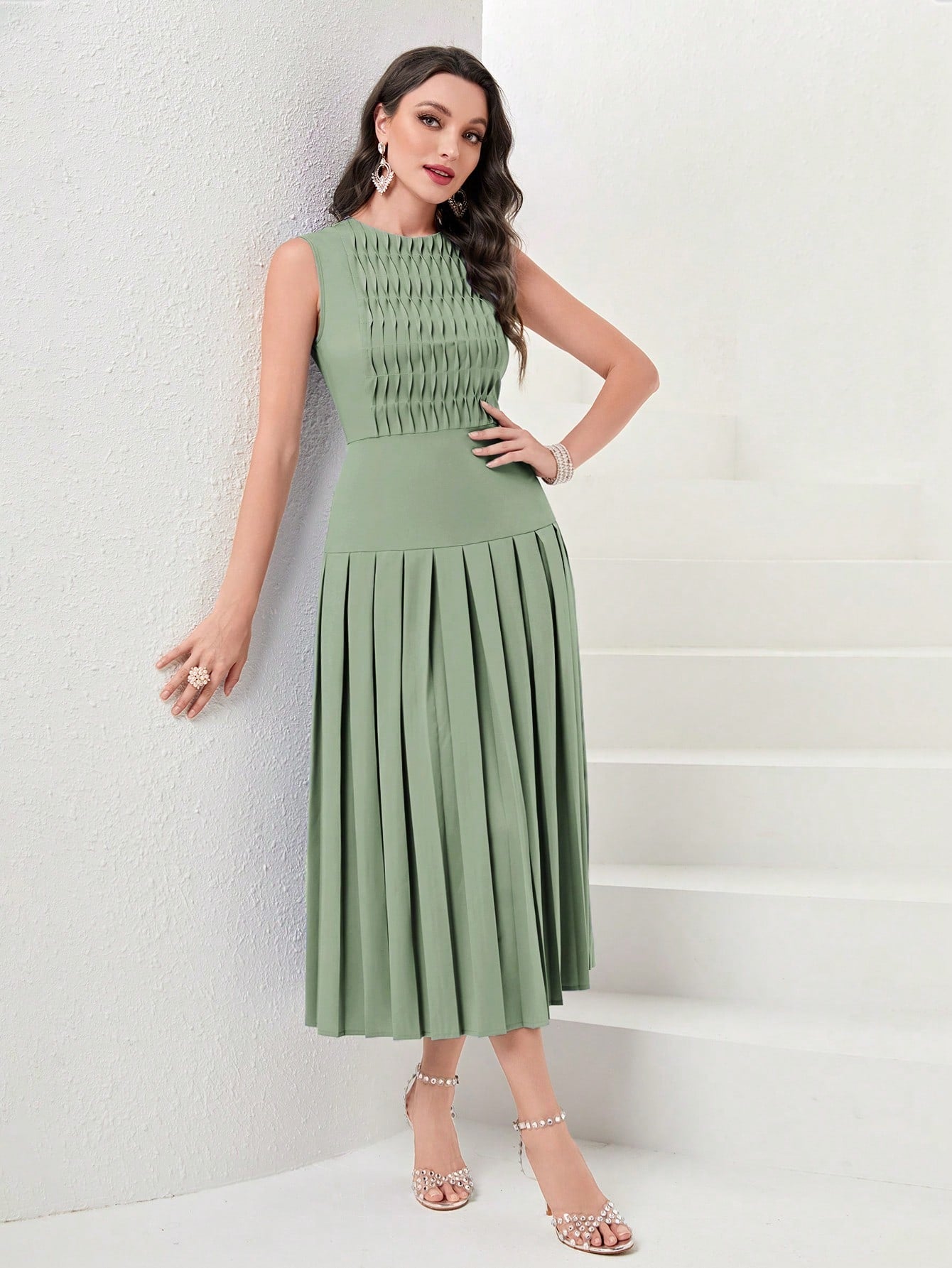 Twirl into the spotlight with this pleated-hem evening dress that's as fun as it is fancy! The flowing length creates dramatic movement while you dance the night away, and the solid color means endless accessorizing possibilities. Who says sophistication can't be playful? This dress proves you can command attention and have a blast doing it!