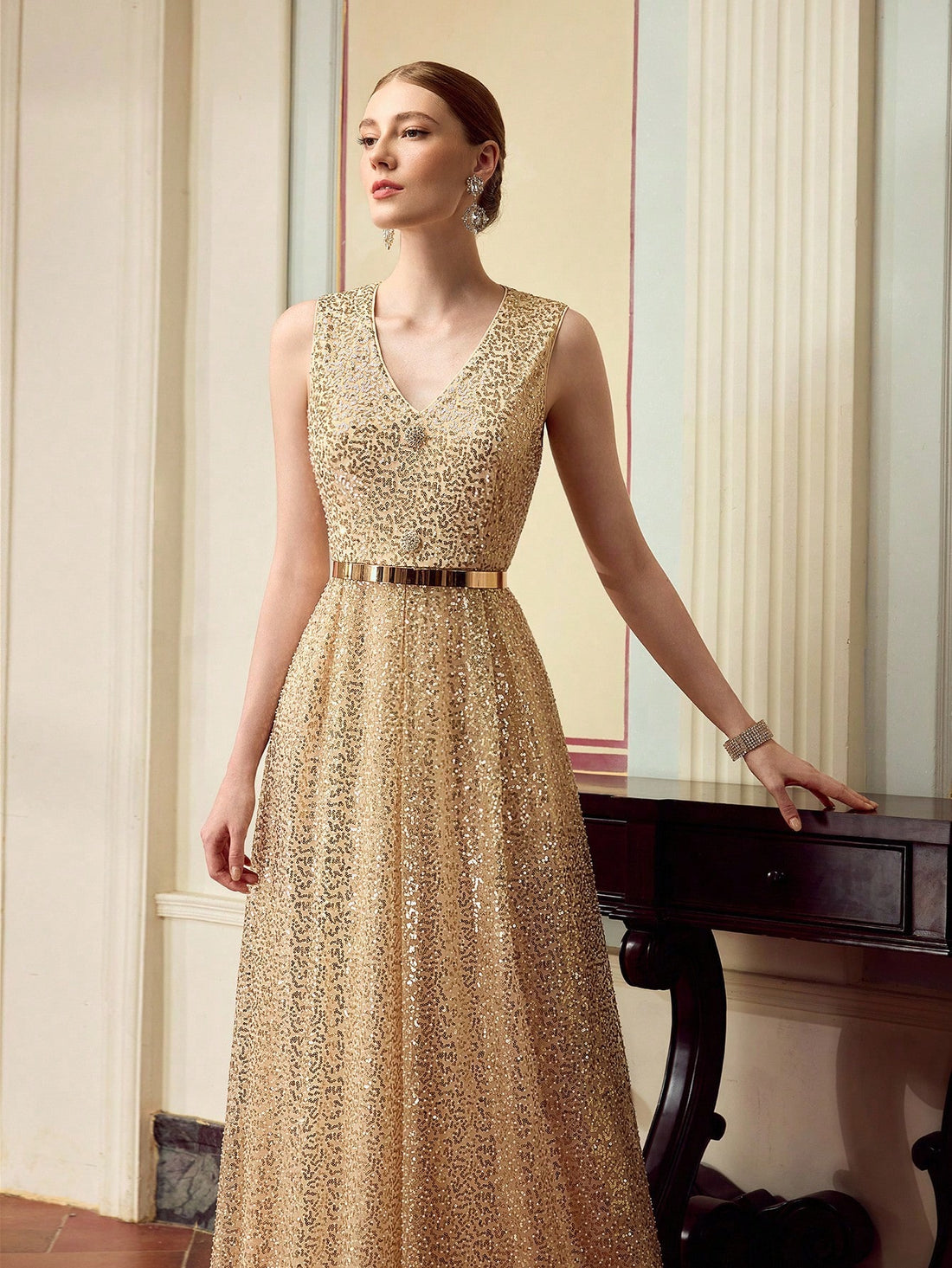 Shine bright and dance the night away in this Elegant Sparkly V-Neck Sleeveless Dress. Designed to highlight your slim waist, this party gown adds just the right amount of sparkle to keep all eyes on you. Its flattering cut and shimmering fabric make every celebration a chance to sparkle with confidence and fun.