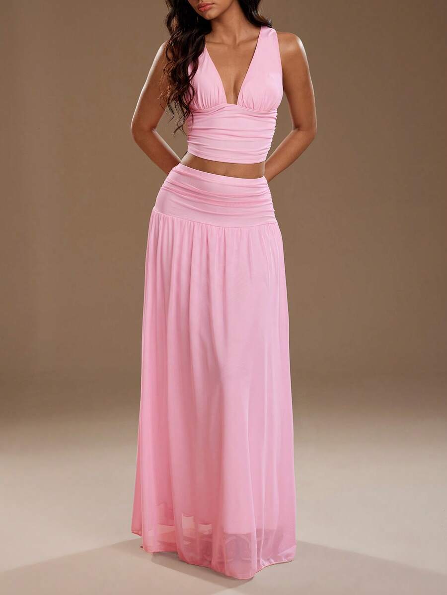 Exude Ethereal Sophistication in Our Elegant Spring-Summer 2-Piece Set!

Experience the breathtaking fusion of romantic heritage and sharp, modern architectural tailoring. This stunning camisole and mesh skirt ensemble is meticulously designed for the woman who values a high-fashion, "quiet luxury" approach to seasonal dressing—the ultimate centerpiece for prestigious garden weddings, exclusive rooftop soirées, and high-authority summer social gatherings.

Iconic Camisole Artistry: Featuring a masterfully c