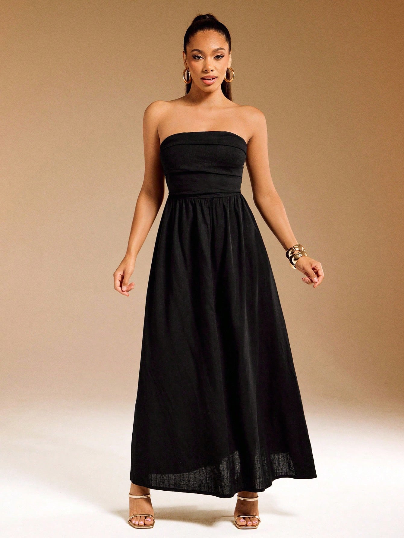 Turn heads this summer with our Elegant Strapless Backless Black Maxi Dress. Its sleek, flowing design keeps you cool and chic, perfect for sunny days and warm nights. The strapless, backless cut adds a flirty touch, making it effortless to style for any occasion. Embrace easy elegance and let your summer wardrobe shine!