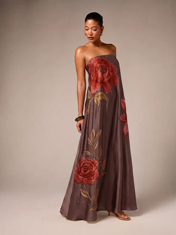 Front view of chocolate brown strapless satin maxi dress with red rose embroidery and flared skirt