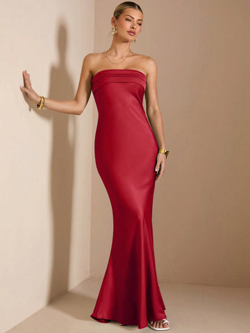 Get ready to turn heads at any cocktail party or formal event with our Elegant Strapless Mermaid Satin Dress! This stunning dress not only features a flattering mermaid silhouette and a strapless design, but it also exudes elegance and sophistication. Perfect for making a statement and standing out from the crowd.