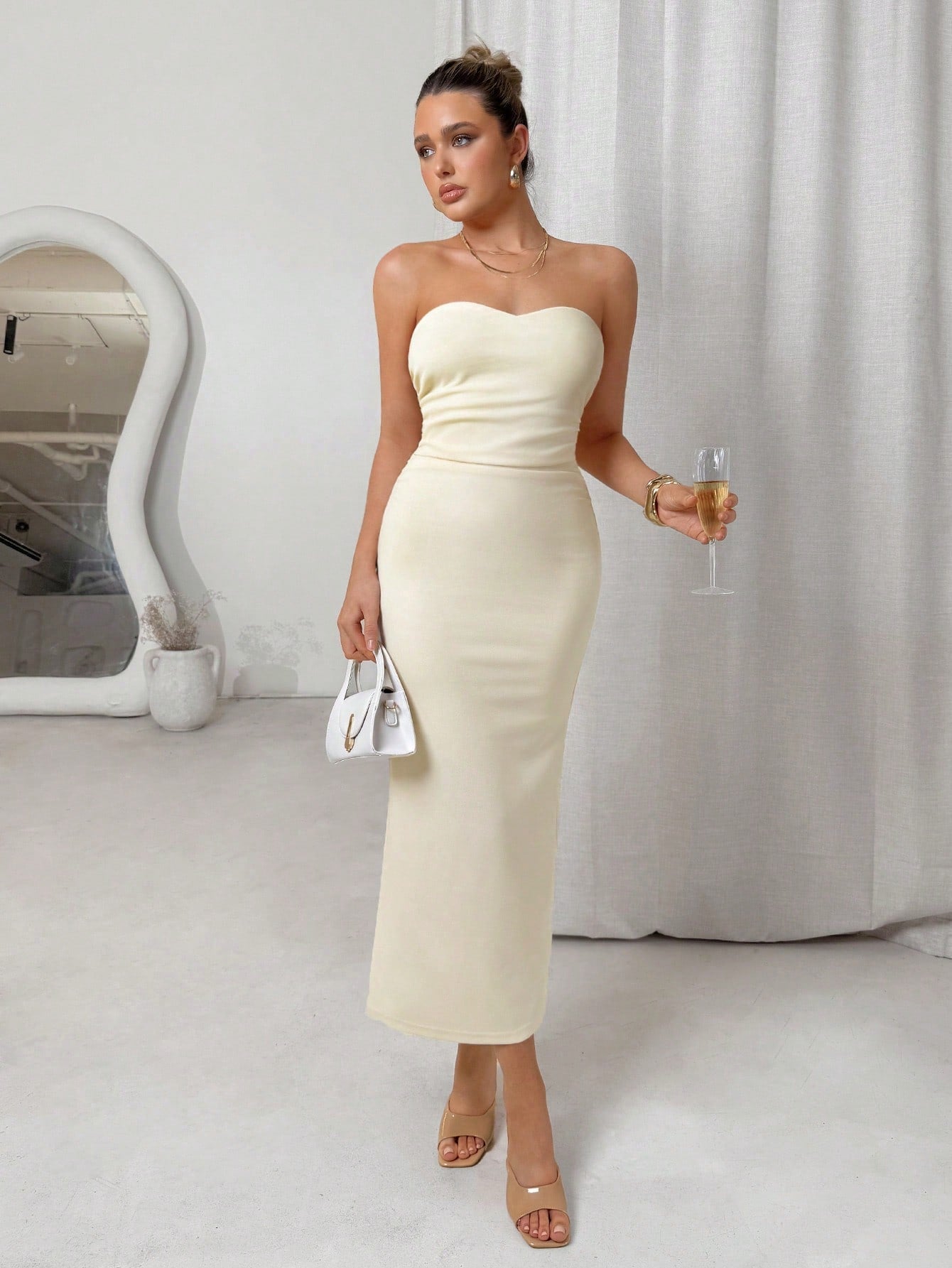 Turn heads at every celebration with this Elegant Strapless Midi Dress. Its ruched design flatters your silhouette while the strapless, sleeveless cut keeps things flirty and fun. Perfect for parties or graduation, this dress combines comfort and style so you can dance the night away with confidence.
