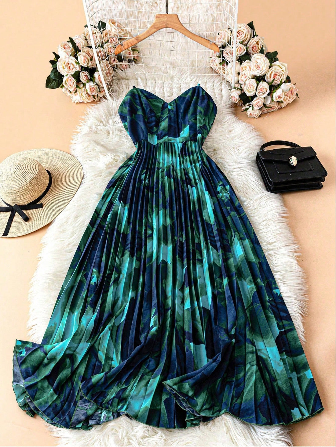 Turn heads at every high-end party with this elegant strapless pleated dress. The delicate transparent shoulder straps add a whimsical touch while keeping the look effortlessly chic. Flowing pleats create graceful movement, making you feel light and radiant all night long. Perfect for dancing, mingling, or stealing the spotlight with playful sophistication.