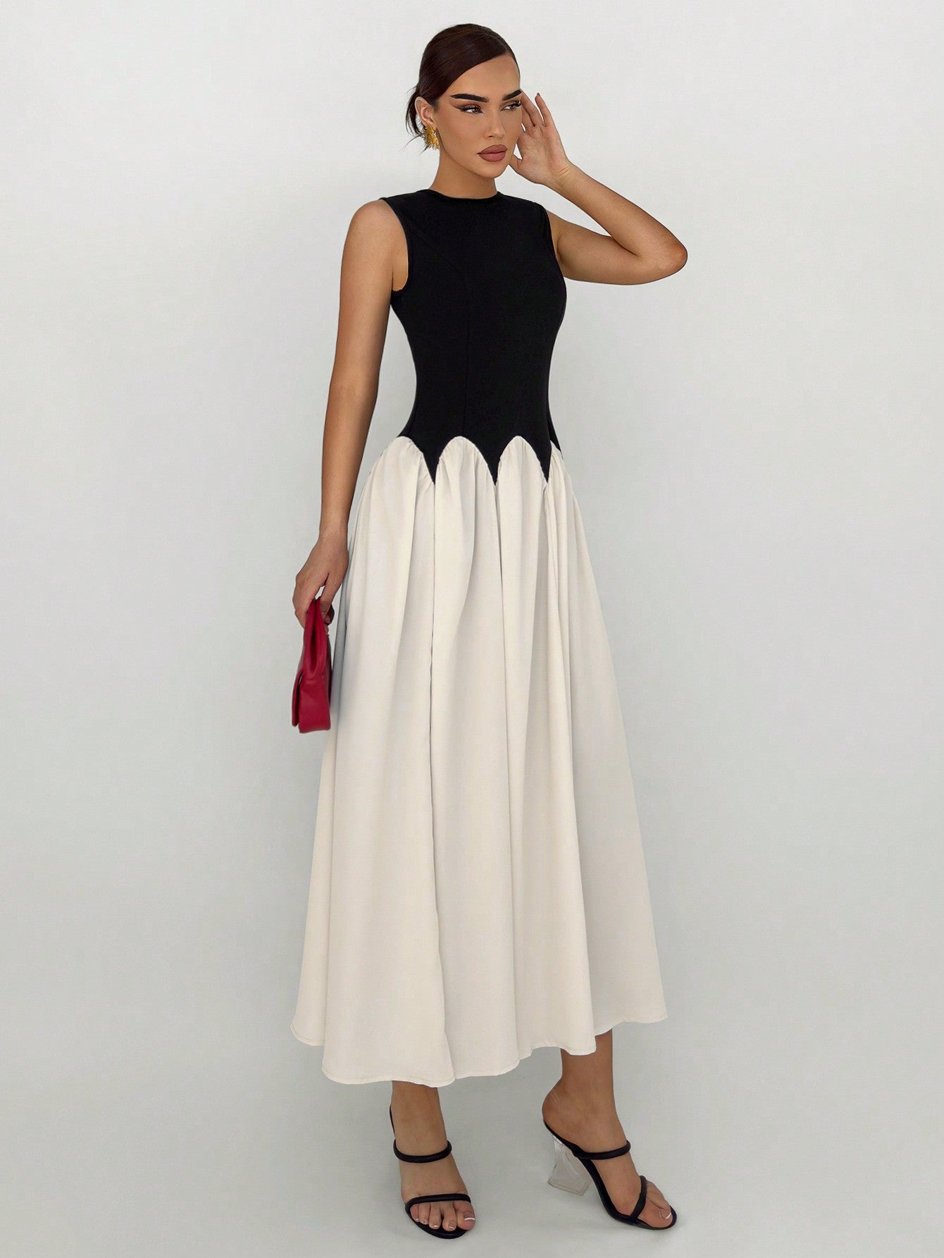 Step into summer with our Elegant Summer Chic: Color Block Sleeveless Dress. Composed of high-quality materials, this dress offers effortless style and comfort. The color block design adds a touch of sophistication while the sleeveless cut keeps you cool and chic. Perfect for any occasion, this dress is a must-have for your summer wardrobe.