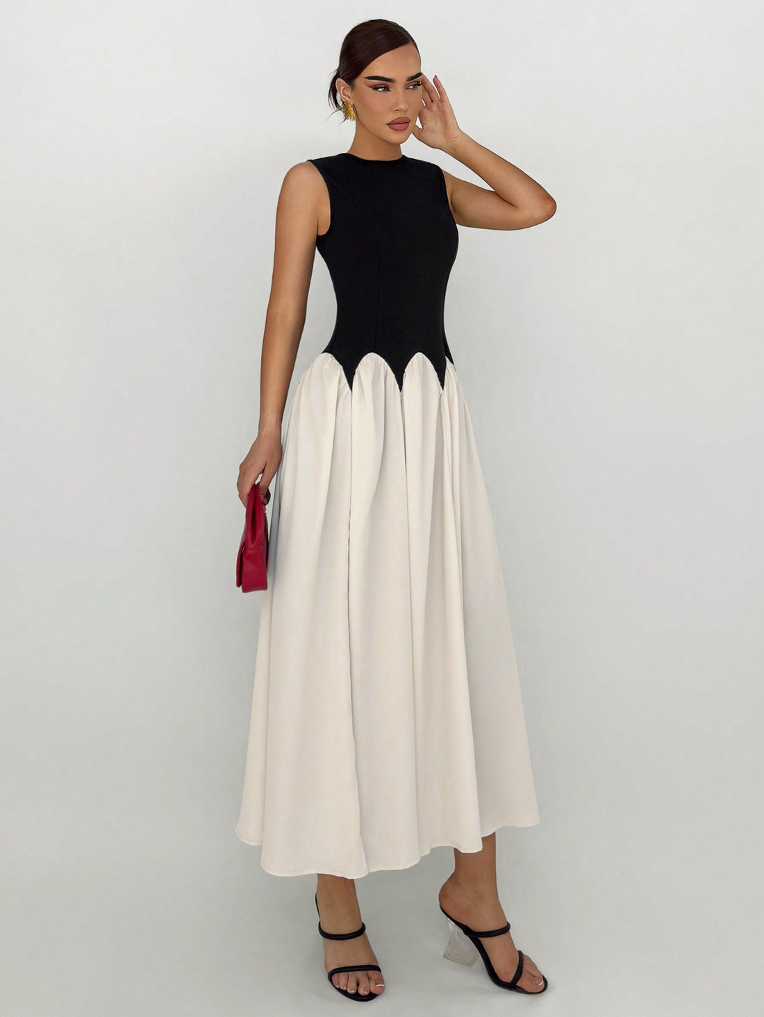 Step into summer with our Elegant Summer Chic: Color Block Sleeveless Dress. Composed of high-quality materials, this dress offers effortless style and comfort. The color block design adds a touch of sophistication while the sleeveless cut keeps you cool and chic. Perfect for any occasion, this dress is a must-have for your summer wardrobe.