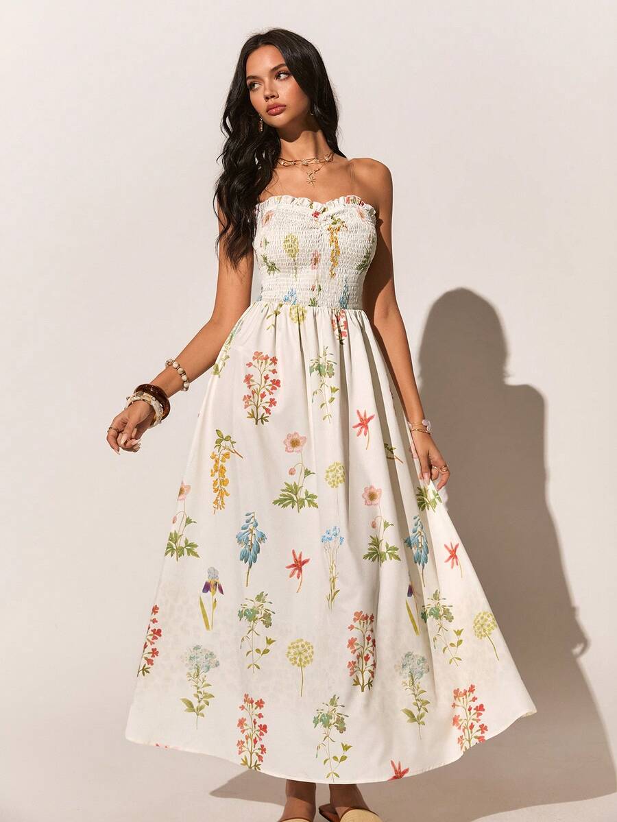 Experience the breathtaking fusion of botanical heritage and sharp, modern architectural tailoring. This stunning floral tube dress is meticulously designed for the woman who values a high-fashion, "quiet luxury" approach to seasonal dressing—the ultimate centerpiece for prestigious beach clubs, exclusive coastal retreats, and high-authority summer social gatherings.