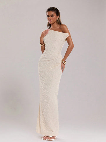 Get ready to rock the beach with this elegant summer maxi dress! Made from soft and breathable knitted crochet fabric, it boasts an asymmetric collar and a unique metal detail, adding a touch of edgy charm to your beach outfit. Make a statement while staying cool and comfortable.