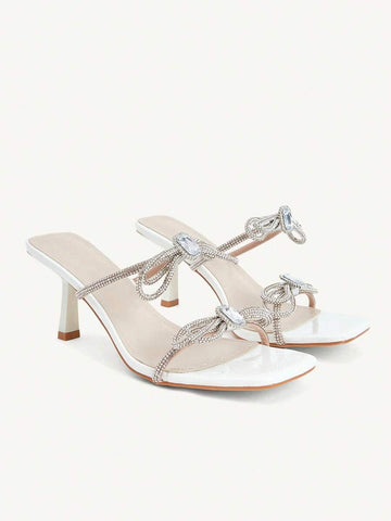 Step into elegance with these stunning rhinestone high heels, designed for the modern woman who loves to shine at special occasions. Featuring a chic square toe silhouette and delicate bow embellishments, these kitten heels offer the perfect balance of comfort and style. Crafted from premium PU leather with a soft fabric lining, they provide all-day wearability without sacrificing sophistication. 