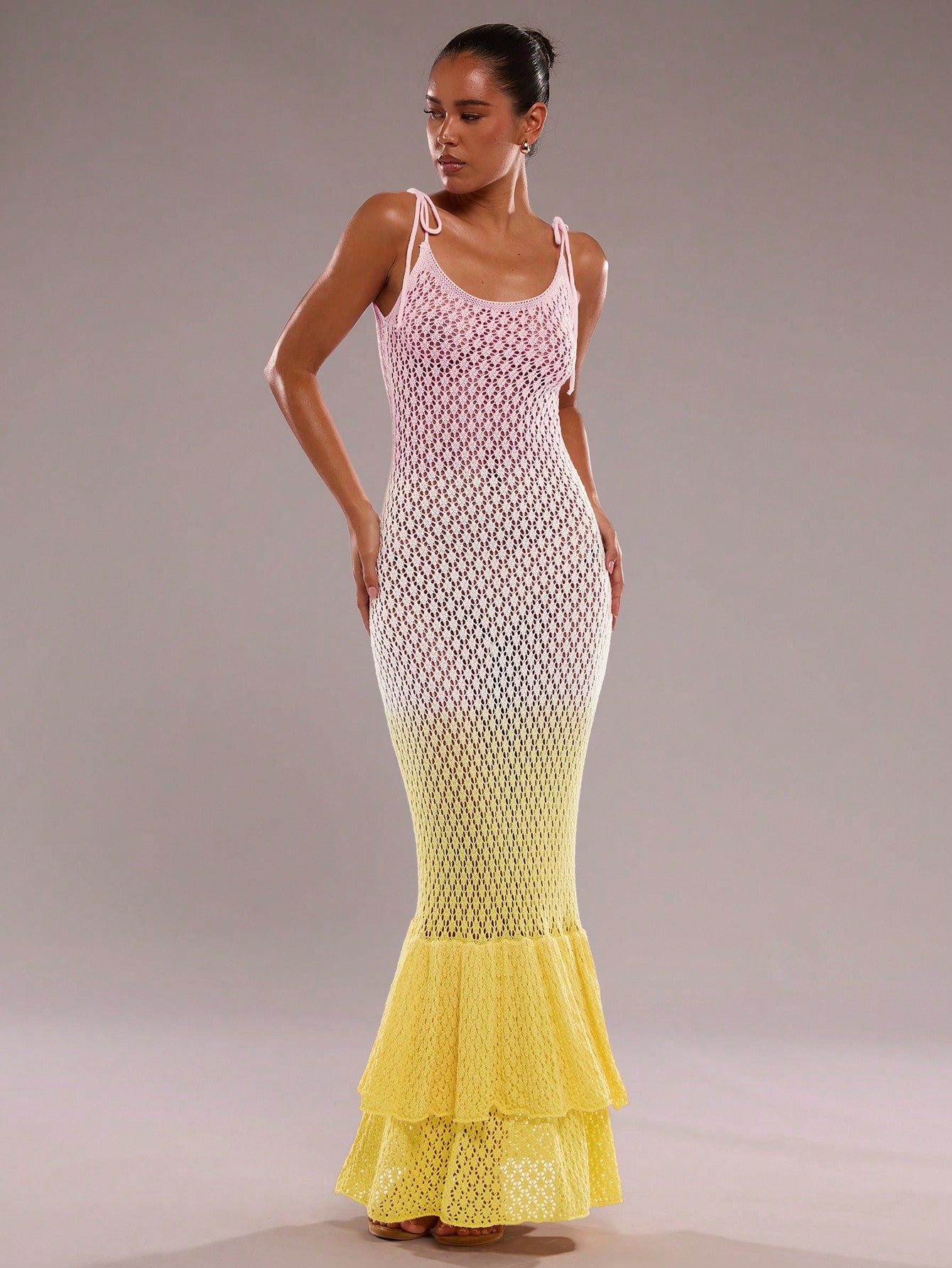 Step into summer with this playful fishtail knit dress, perfect for seaside adventures. Featuring charming ruffles and a stylish gradient hollow-out design, it combines comfort and flair effortlessly. Its breezy knit fabric keeps you cool while the fishtail silhouette adds a fun, flirty touch to your vacation wardrobe. Ideal for beach strolls or sunset dinners, this dress brings a splash of elegance to your sunny getaways.