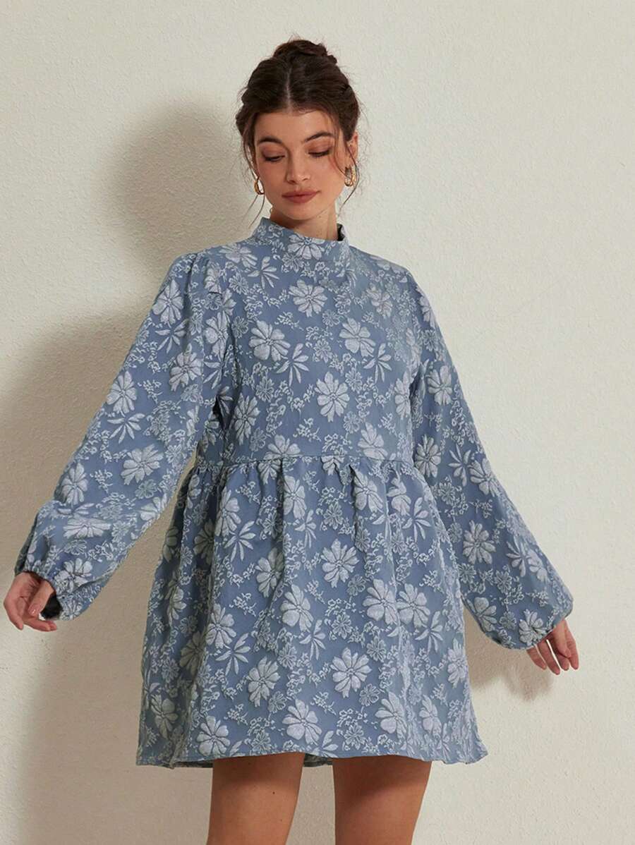 Step into seasonal style with this exquisite floral mini dress. The elegant A-line cut and voluminous lantern sleeves deliver sophisticated charm perfect for autumn gatherings. Its all-over botanical print in deep blue tones brings visual depth, while the high-waist silhouette provides a flattering fit. Built from 100% polyester woven fabric with a refined stand collar and button accents, this piece transitions effortlessly between casual brunches and evening events. The gracefully flared hem creates moveme