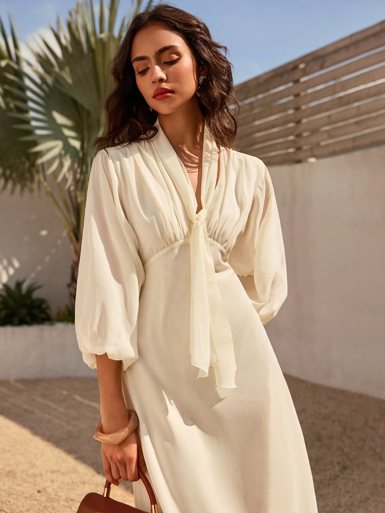 Step into summer with this playful and elegant V-neck chiffon dress, perfect for your beach escapes. Lightweight and breezy, its patchwork design adds a splash of color and charm, while lantern sleeves bring a whimsical touch. The tie waist lets you flaunt your silhouette effortlessly, combining comfort with style. Whether it’s a sunset stroll or a seaside picnic, this dress is your go-to for easy, chic vibes under the sun.