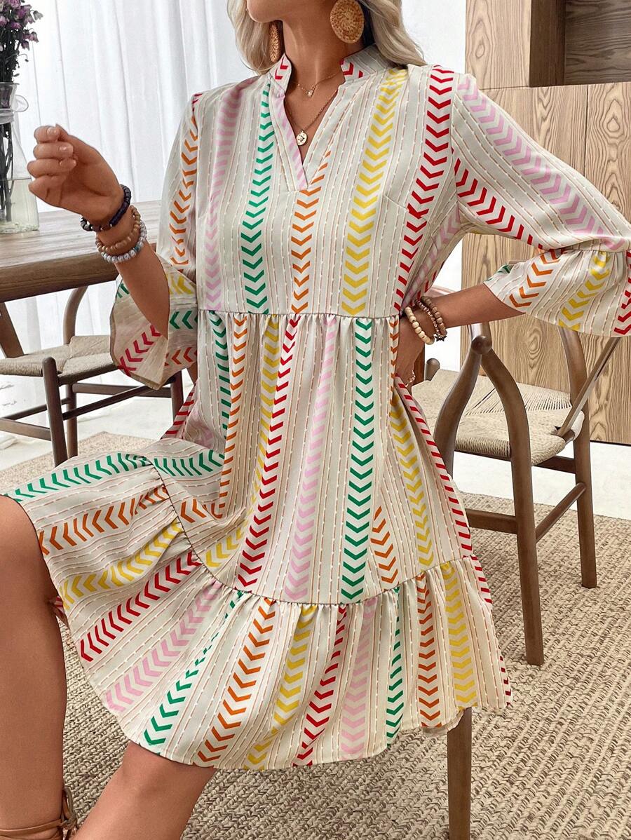 Elevate your wardrobe with this charming V-neck layered dress, designed for effortless style at any occasion. Featuring a notched neckline, flare sleeves, and a high-waisted silhouette, this piece combines comfort with contemporary flair. The striped and all-over print pattern adds visual interest, while the ruffled hem and flounce detailing create a playful, feminine touch. Crafted from a breathable polyester-elastane blend, this regular-fit dress moves with you throughout the day. Perfect for beach outing