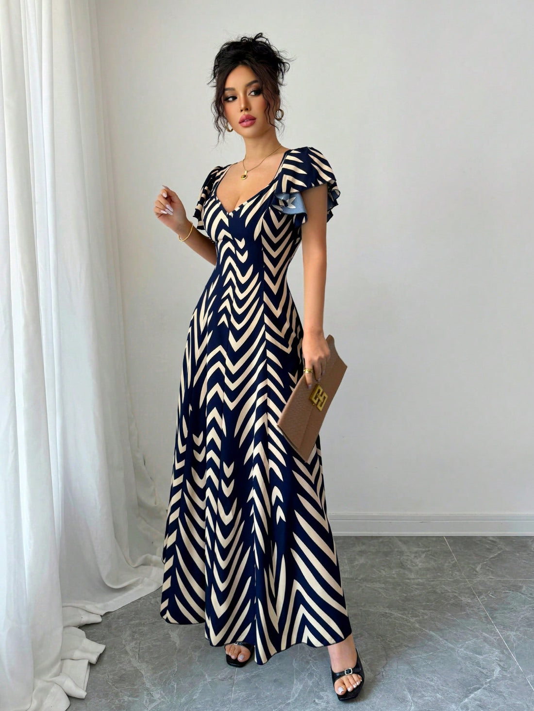 Effortlessly chic and oh-so-comfortable, this V-neck midi dress brings botanical vibes to your warm-weather wardrobe. The flattering leaf print adds visual interest while the elastic waist ensures a perfect fit that moves with you. Whether you're strolling through farmers markets or catching up with friends over brunch, this breezy piece transitions seamlessly from casual day looks to relaxed evening outings. The midi length offers just the right amount of coverage while keeping things light and airy. A spr