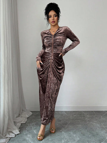 Turn heads at your next event in this stunning V-neck long sleeve dress that effortlessly blends sophistication with modern flair. The asymmetrical hem and chic back slit create an eye-catching silhouette that moves beautifully with you, while the elegant V-neckline flatters every frame. Whether you're celebrating a special occasion or making a grand entrance at a party, this dress delivers the perfect balance of glamour and comfort. Dress it up with heels and statement jewelry, or keep it casually chic—thi