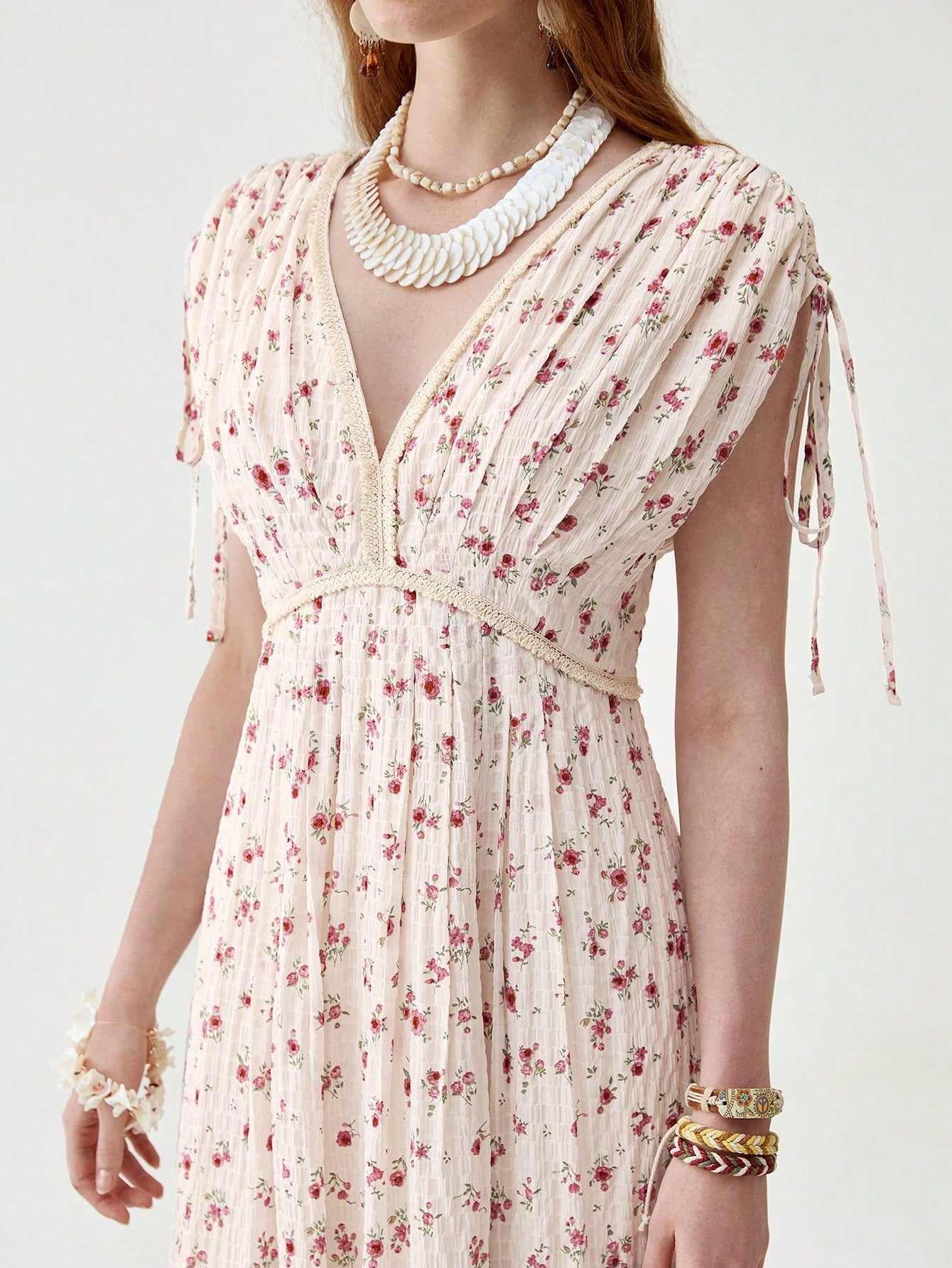 Float through spring and summer in this playful V-neck boho dress! The pleated design adds a flirty bounce to your step, while the drawstring lets you customize your fit for all-day comfort. Perfect for beach days, festival adventures, or simply turning heads on a casual stroll. This long dress brings effortless elegance to your warm-weather wardrobe!