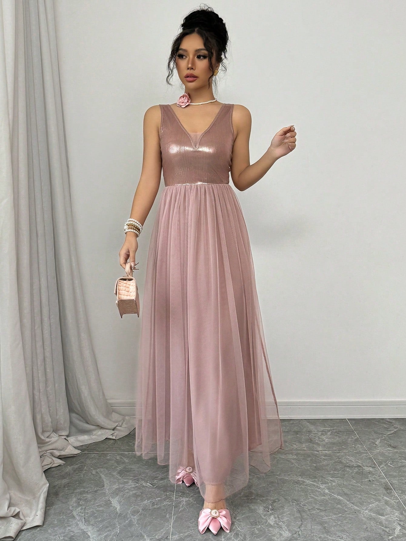 Turn heads effortlessly in this Elegant V-Neck Sleeveless Mesh Dress. Its airy mesh fabric keeps you cool while the flattering V-neck adds a hint of allure. Perfect for everything from garden parties to evening outings, this dress blends comfort with style so you can dance, mingle, and shine all night long.