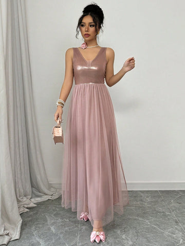 Turn heads effortlessly in this Elegant V-Neck Sleeveless Mesh Dress. Its airy mesh fabric keeps you cool while the flattering V-neck adds a hint of allure. Perfect for everything from garden parties to evening outings, this dress blends comfort with style so you can dance, mingle, and shine all night long.