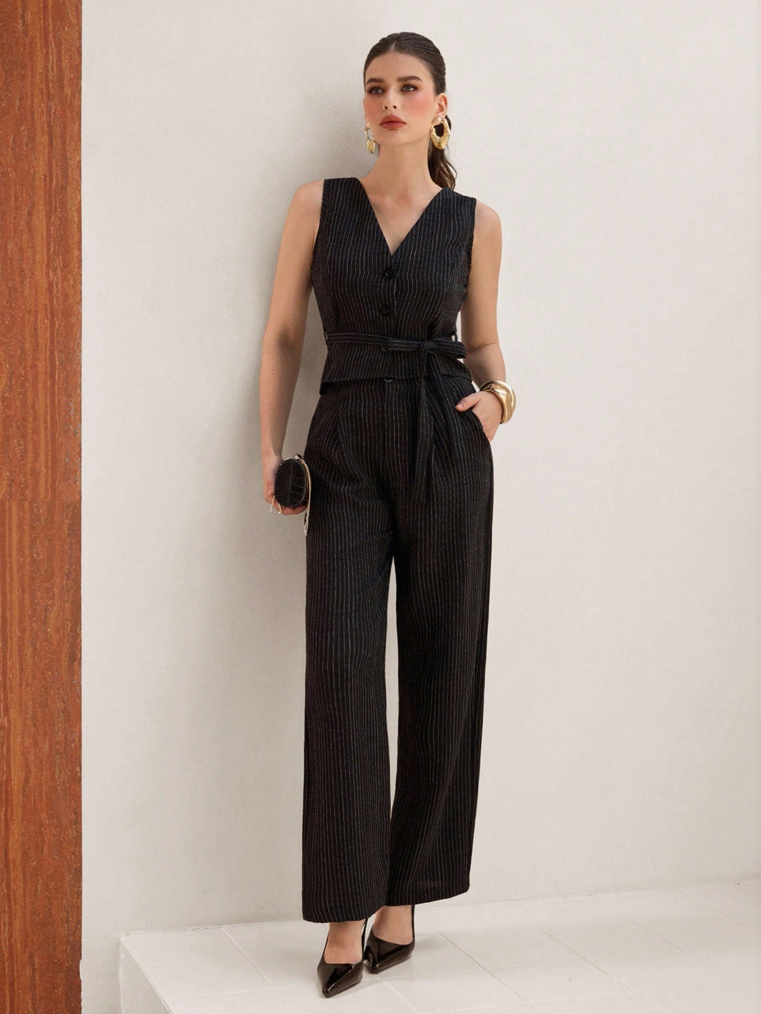 Stripes never go out of style—and this chic two-piece set proves it! Pair the sleek V-neck sleeveless top with tailored straight-leg pants for an effortlessly polished look that works from the office to weekend brunch. The timeless striped pattern adds visual interest while the clean silhouette keeps things sophisticated. Mix, match, or wear together—this versatile set is your new go-to for looking put-together without trying too hard.