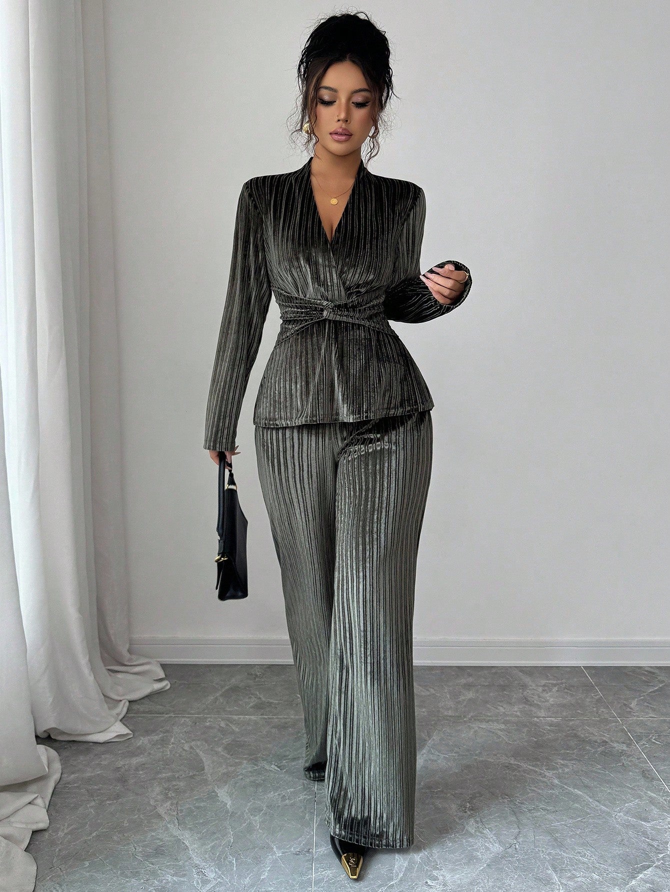 Elevate your everyday style with this fabulous two-piece set that's equal parts sophisticated and fun! The elegant V-neck top features a chic twist waist detail that cinches beautifully, while long sleeves add polish to any occasion. Pair it with the flattering flare leg pants for a silhouette that turns heads. Whether you're heading to brunch, the office, or a night out, this set delivers effortless chic vibes. Perfect for women who refuse to compromise on style or comfort—because looking good shouldn't fe