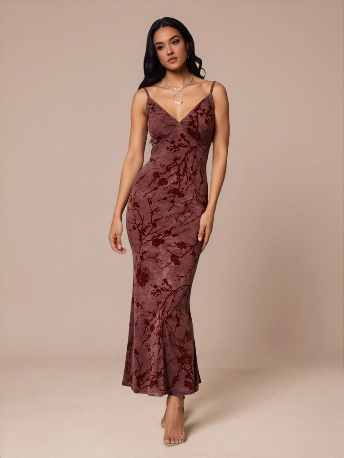 Slip into sophistication with this stunning velvet floral dress that's ready to turn heads at any event. The delicate spaghetti straps and flattering deep V-neckline create an effortlessly chic silhouette, while the luxurious velvet fabric adds a touch of glamour and texture. Whether you're heading to a dinner date, cocktail party, or special celebration, this versatile piece transitions seamlessly from day to night. The intricate floral pattern brings a romantic flair that feels both timeless and on-trend.