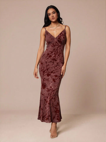Slip into sophistication with this stunning velvet floral dress that's ready to turn heads at any event. The delicate spaghetti straps and flattering deep V-neckline create an effortlessly chic silhouette, while the luxurious velvet fabric adds a touch of glamour and texture. Whether you're heading to a dinner date, cocktail party, or special celebration, this versatile piece transitions seamlessly from day to night. The intricate floral pattern brings a romantic flair that feels both timeless and on-trend.