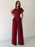 Elevate your wardrobe with this sophisticated 2-piece outfit set designed for the modern woman. Featuring an elegant burgundy blouse with distinctive batwing sleeves and a relaxed round neckline, paired with tailored long pants, this set effortlessly transitions from office meetings to weekend getaways. The loose-fitting silhouette offers comfort without compromising style, while the premium blend of 94% polyester and 6% elastane ensures durability and a refined drape. 