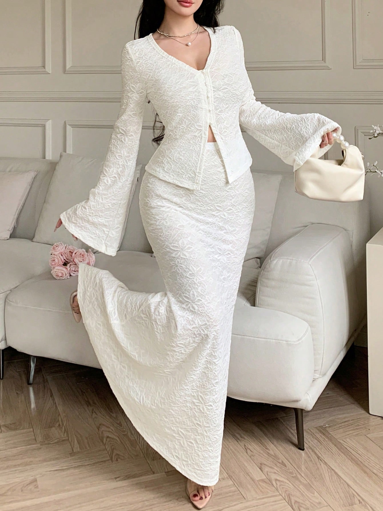 Elevate your wardrobe with this stunning 2-piece white jacquard set that's basically your new best friend! The V-neck top features charming flared sleeves that add just the right amount of flair, while the jacquard texture brings sophisticated elegance to every moment. Whether you're dressing up for a special event or keeping it casual with your favorite jeans, this versatile set delivers timeless style with a playful twist. Perfect for anyone who refuses to choose between comfort and looking absolutely fab