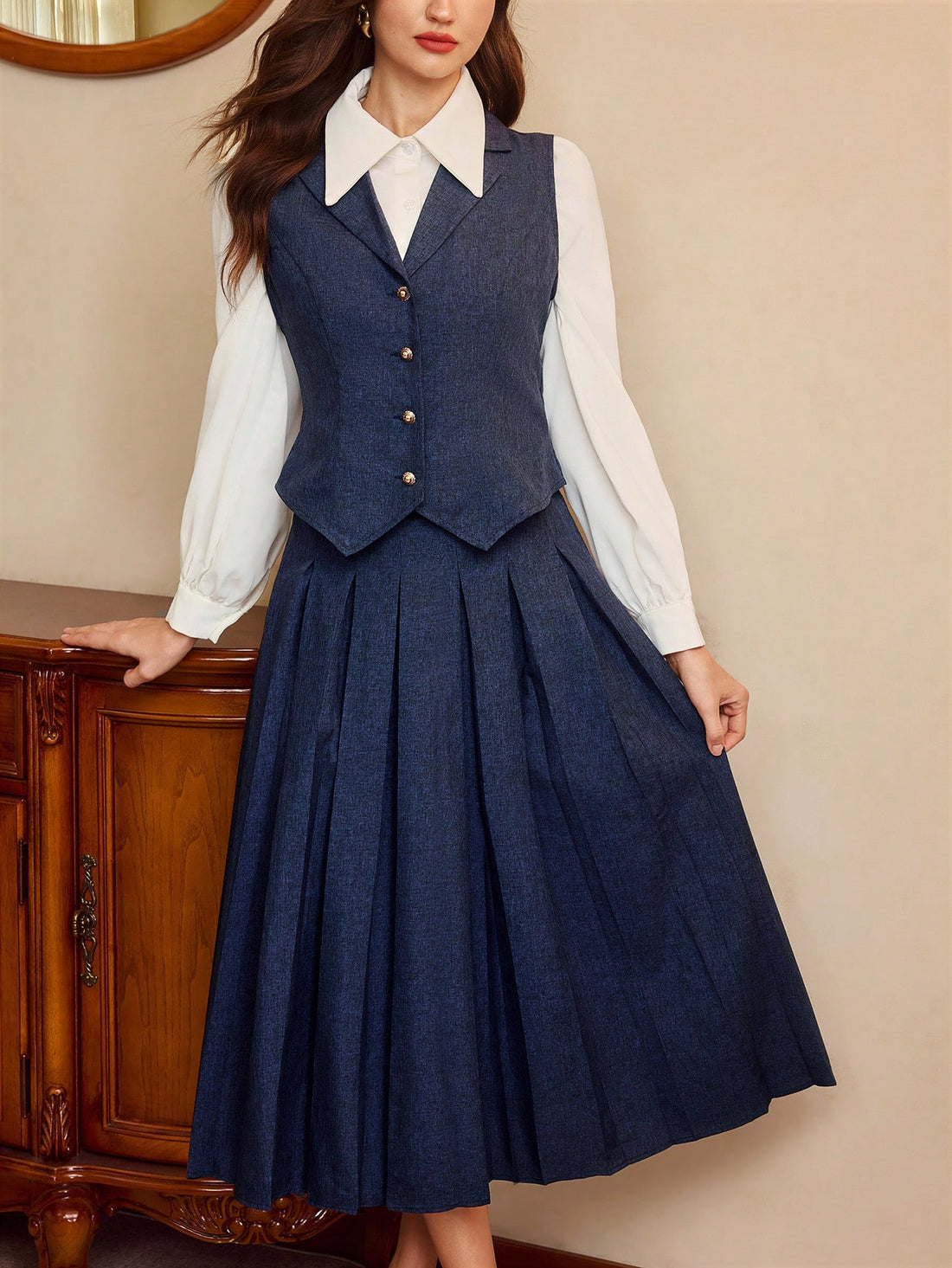 Step back in time with this charming vintage-inspired 2-piece set that brings timeless elegance to your wardrobe. The perfectly fitted navy vest pairs beautifully with a coordinating skirt, creating a polished look that works for brunch dates, office days, or special occasions. This classic combination flatters your silhouette while delivering that coveted retro vibe. Mix and match with your favorite pieces or wear them together for an instantly put-together ensemble that feels both sophisticated and playfu