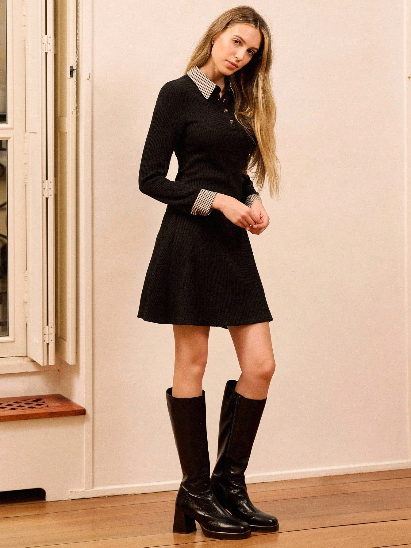 Step into timeless elegance with this chic black rib knit mini dress—a vintage-inspired piece that's anything but boring. The fitted ribbed fabric hugs in all the right places, while the printed collar and cuff details add a playful pop of personality. Perfect for layering through autumn and winter, this dress transitions effortlessly from casual coffee dates to evening outings. The mini silhouette keeps things flirty and fun, making it a wardrobe essential for anyone who loves classic style with a twist.