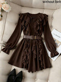 Elevate your wardrobe with this sophisticated vintage-inspired mini dress in rich coffee brown. Featuring an eye-catching ruffled hem and extra-long sleeves, this piece delivers timeless elegance with modern flair. Crafted from a durable woven blend of polyester and polyamide, the regular fit silhouette flatters effortlessly. The unlined construction keeps it lightweight and breathable, perfect for layering or wearing solo. Machine washable for easy care, this dress transitions seamlessly from casual outing