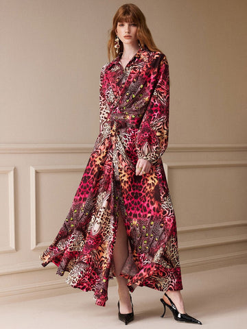 Full front view of long rose-red multicolor animal-print shirt dress with collar, tie waist and flowing slit skirt.